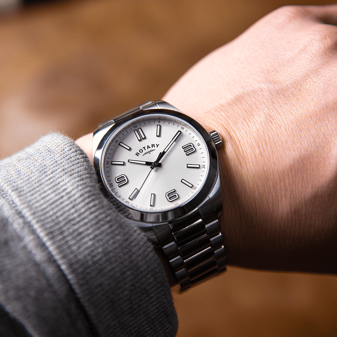 Rotary GB05770-62 watch in stainless steel with a white dial and stainless steel bracelet being worn by a man