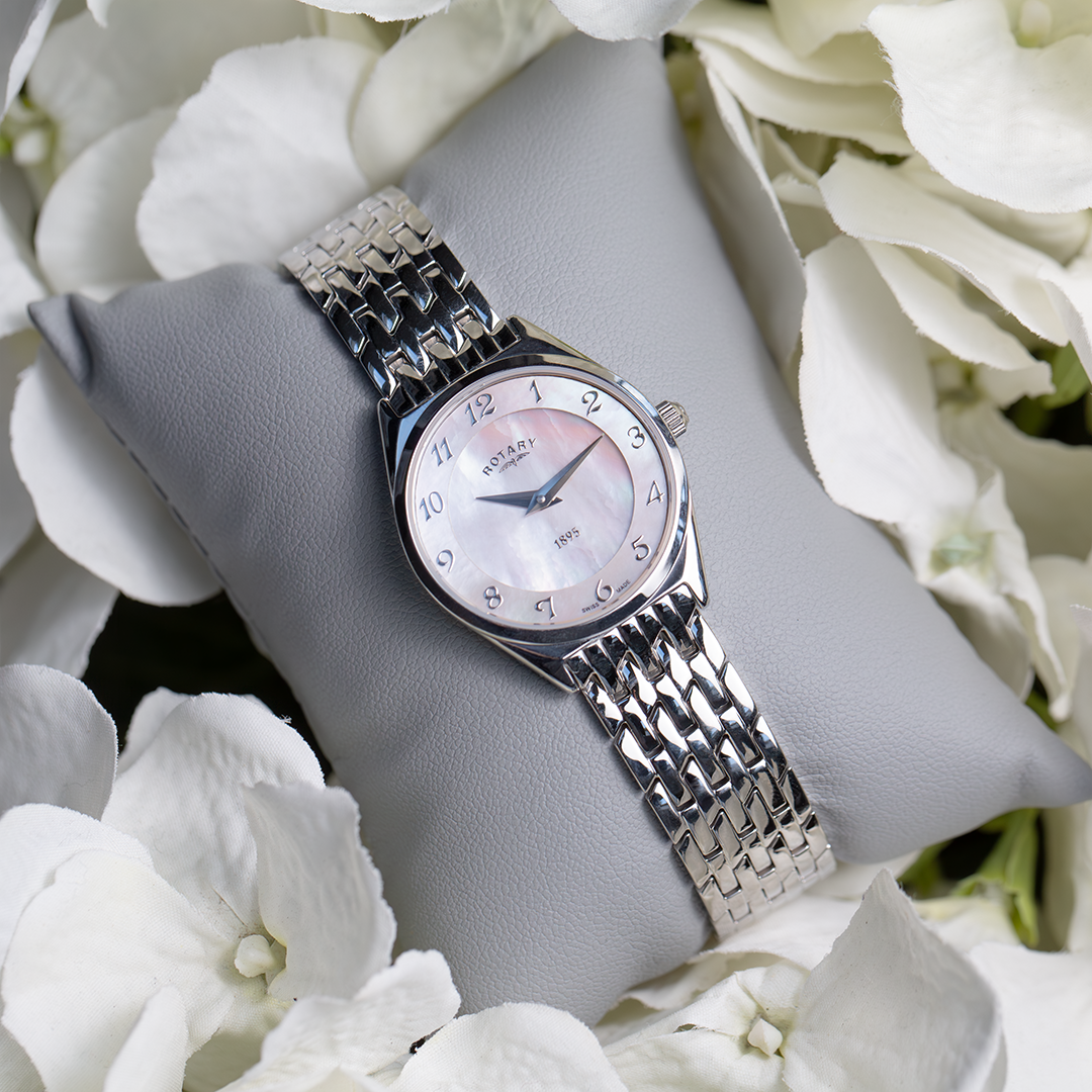 Rotary Ultra Slim ladies watch with a mother of pearl dial pictured on a bed of flowers