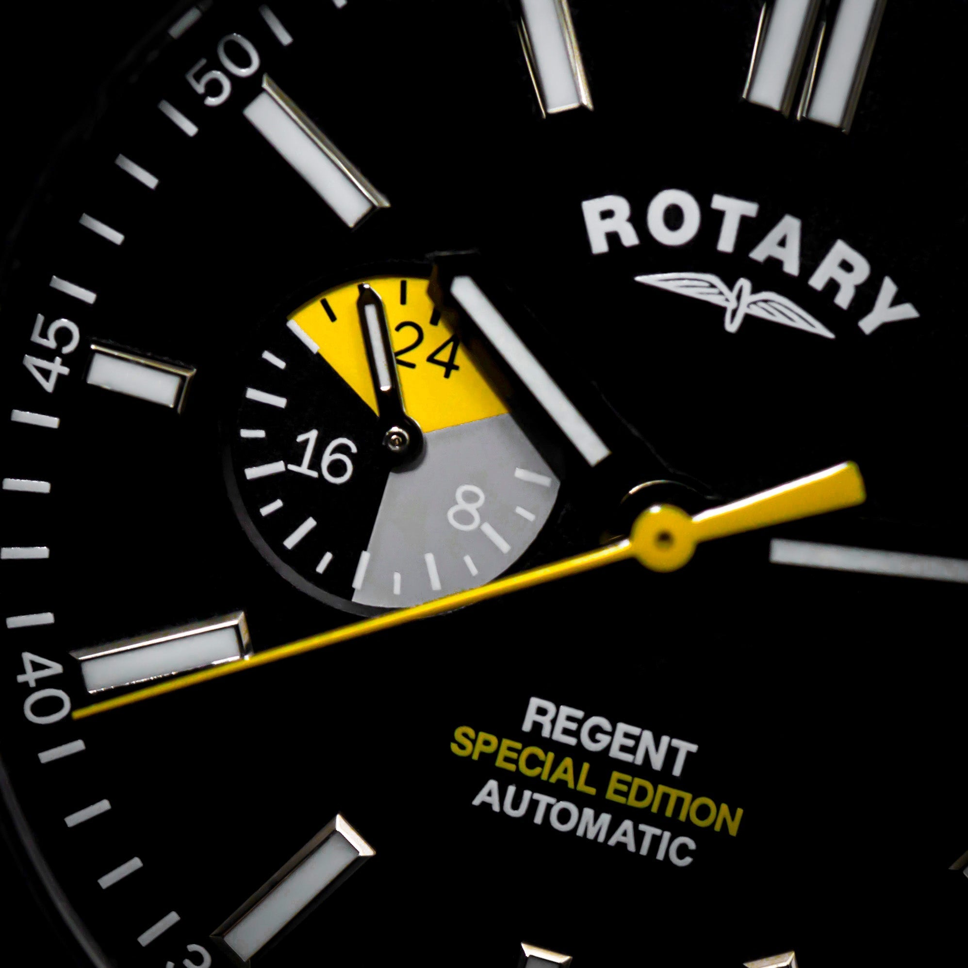 a close up of the rotary regent automatic special edition watch showcasing the yellow accenting